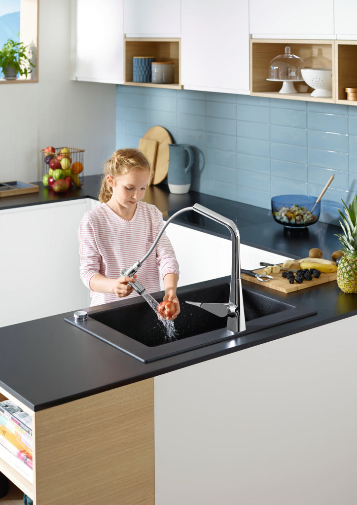 kid washing apple with hansgrohe pull out spray kitchen sink mixer