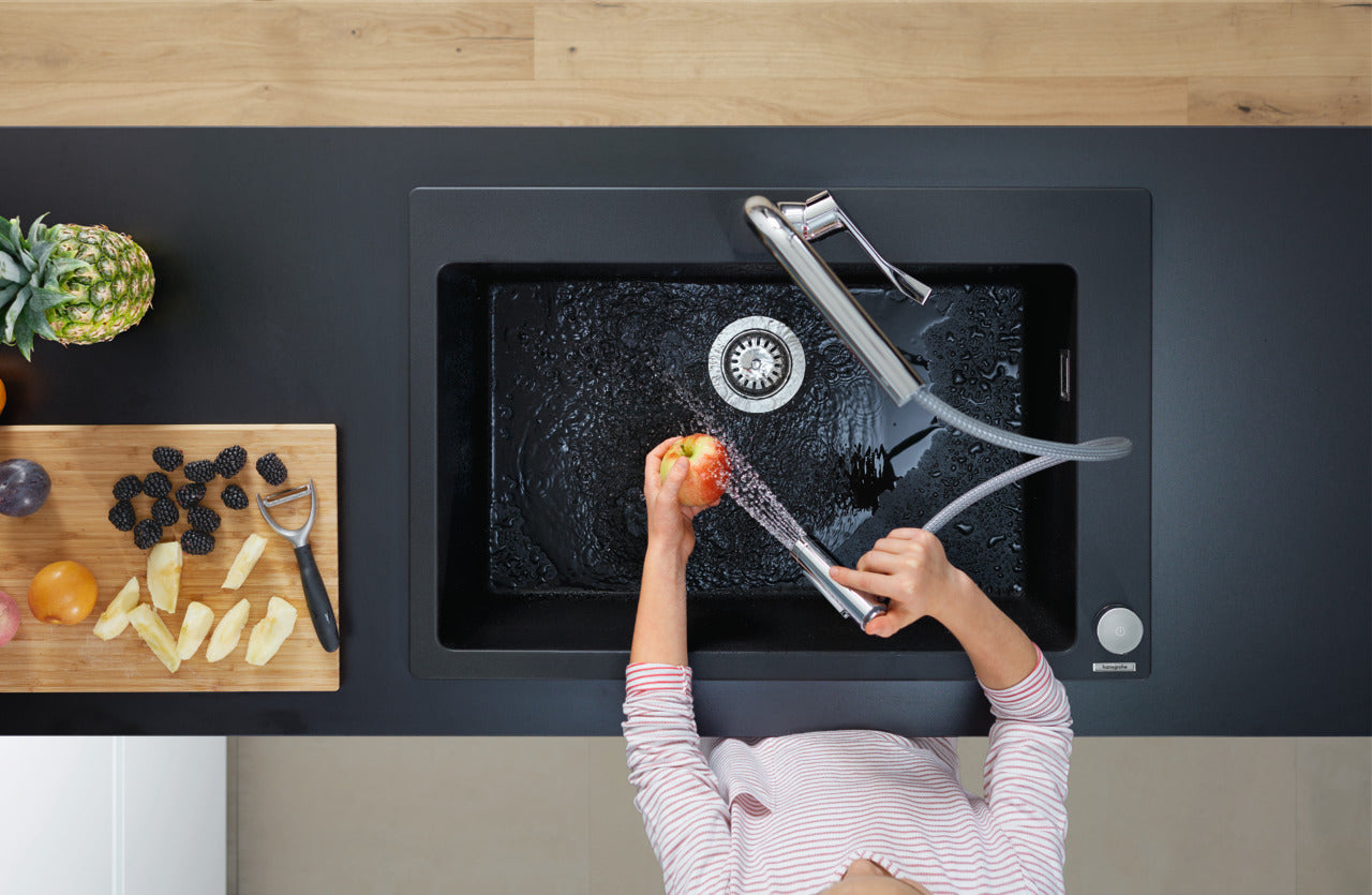 kid washing apple with hansgrohe pull out spray kitchen sink mixer